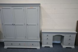 A COTSWOLD COMPANY TWO PIECE BEDROOM SUITE, comprising a triple door wardrobe, with two drawers,