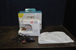 A BOXED SINGER SERENADE SEWING MACHINE with cover and power pedal (PAT pass and working)
