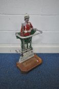 A PAINTED CAST IRON UMBRELLA STAND, in the form of a military man 'THE MAN IN KHAKI', width 38cm x