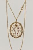A YELLOW METAL RUBY AND SEED PEARL LAVALIER PENDANT AND CHAIN, oval open work pendant, set with five