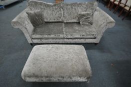 A DFS GREY UPHOLSTERED TWO PIECE SUITE, comprising a two seater sofa, with scrolled arms, length
