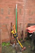 A SELECTION OF GARDEN TOOLS including pick axe, axe, sledgehammers, forks, spades, hoes etc