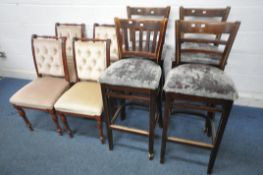A SET OF FOUR MAHOGANY BUTTON BACK CHAIRS, with beige upholstery, along with a set of four bar