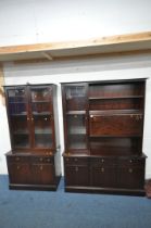 A STAG MINSTREL DRESSER, the top section fitted with an arrangement of shelving, a bevelled glass