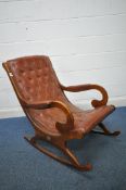 A MAHOGANY FRAMED SLIPPER ROCKING CHAIR, with buttoned leather upholstery, width 64cm x depth 99cm x