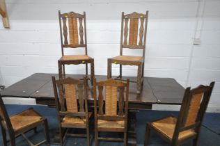 A 20TH CENTURY FRENCH OAK DRAW LEAF BRETON TABLE, raised on four bulbous legs, united by a block