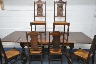 A 20TH CENTURY FRENCH OAK DRAW LEAF BRETON TABLE, raised on four carved standing figures, united