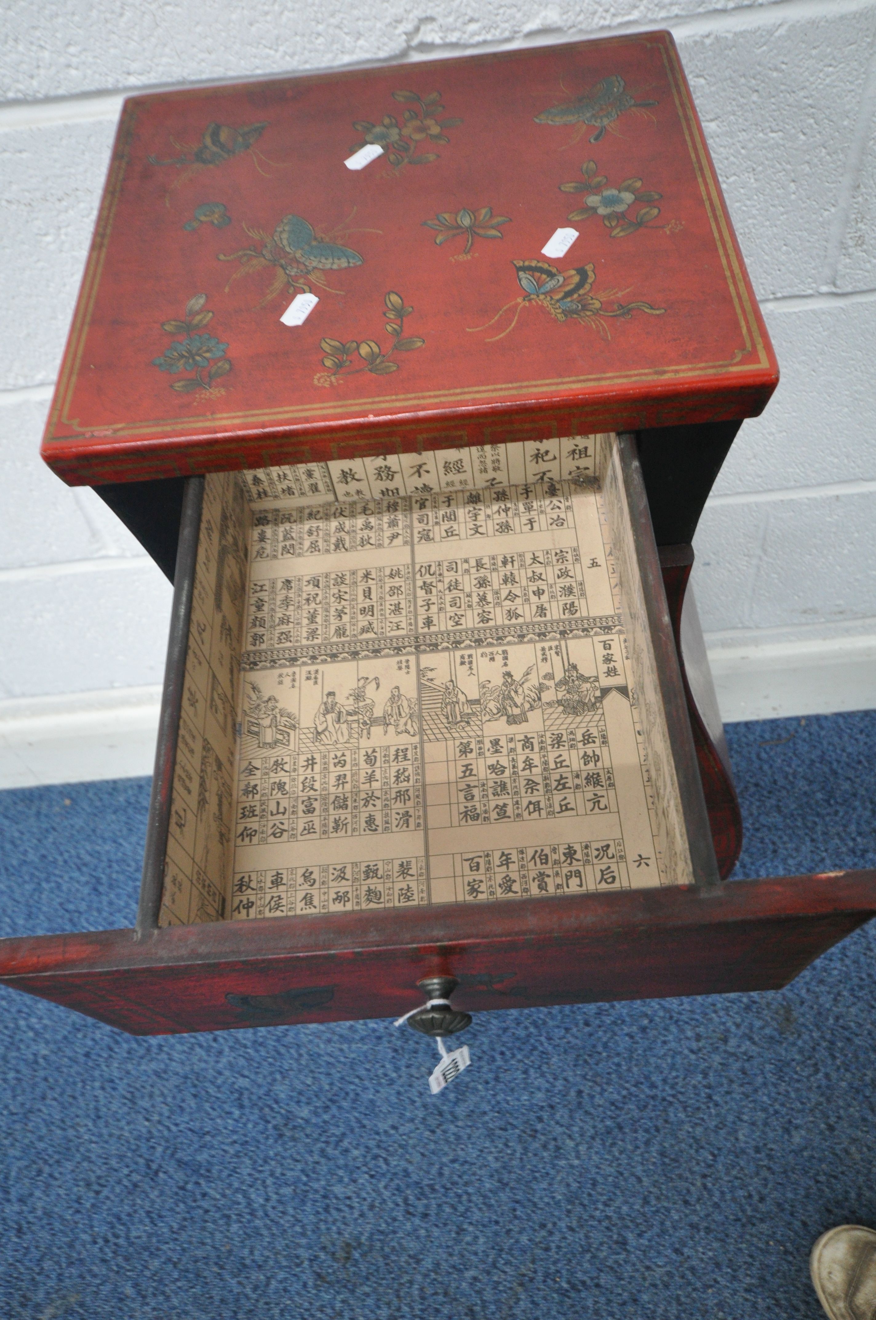 A CHINESE STYLE RED FINISH CHEST OF SEVEN DRAWERS, decorated in the chinoiserie taste with foliage - Image 5 of 6
