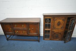 A 20TH CENTURY OAK SIDEBOARD, fitted with two drawers, flanked by two cupboard doors, on barley
