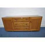 A MID CENTURY ELM ERCOL WINDSOR ROLLING SIDEBOARD, fitted with two cupboard doors, flanking three