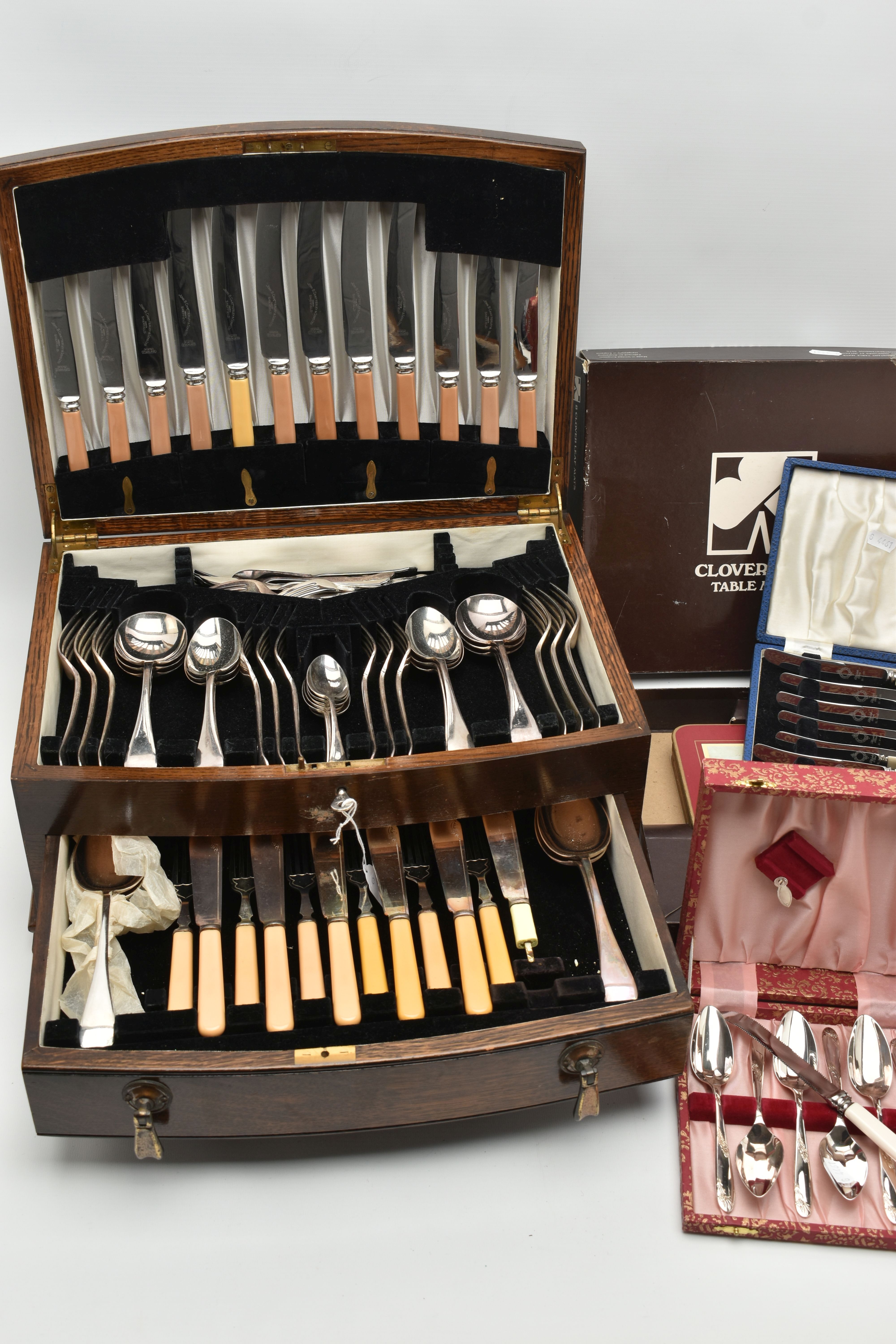 A CANTEEN OF EPNS CUTLERY AND FURTHER CUTLERY AND MATS, the wooden canteen with hinged lid and