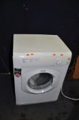A HOTPOINT TVHM80 TUMBLE DRYER with pipe width 60cm depth 54cm height 85cm (PAT pass and working)