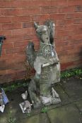 A FIGURE OF A GRIFFIN HOLDING A COAT OF ARMS, possibly made from 18th century Coade Stone,