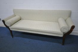 A GEORGIAN SOFA, with scrolled armrests, foliate upholstery, on cylindrical tapered legs and brass