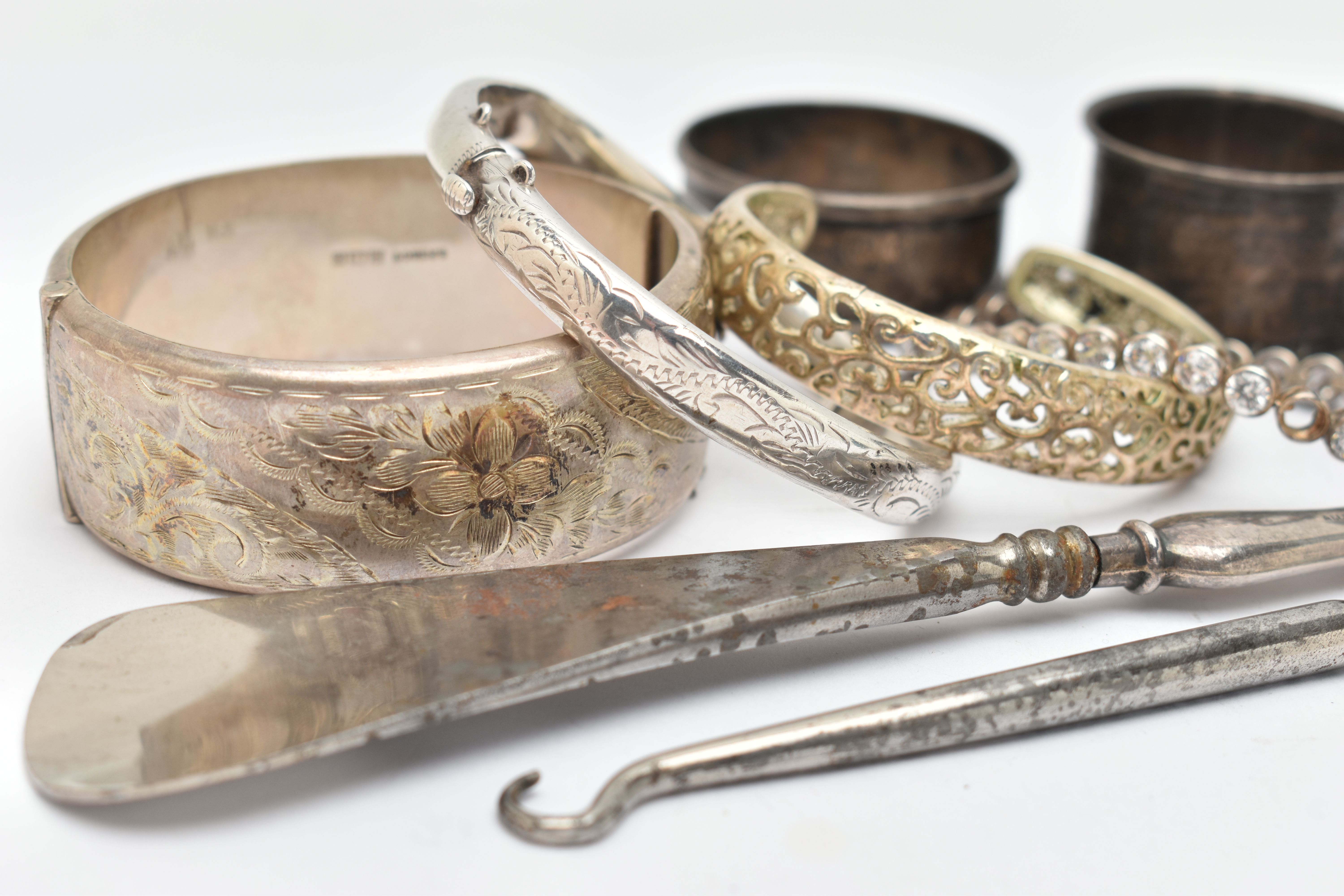 SILVER BANGLES, NAPKIN RINGS AND OTHER ITEMS, to include a silver wide hinged floral bangle, push - Image 3 of 4