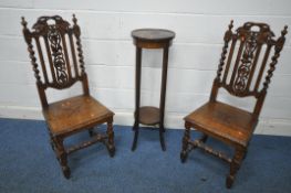 A PAIR OF 20TH CENTURY OAK CHAIRS, with foliate carved crest and back rest, flanked by two finials