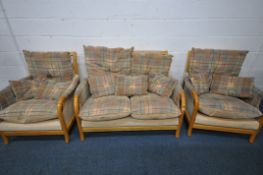 A THREE PIECE LOUNGE SUITE, with beech frames, comprising a two seater sofa and a pair of