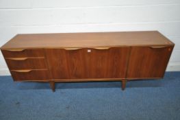 A MID CENTURY TEAK MCINTOSH SIDEBOARD, fitted with three drawers and three cupboard doors, on