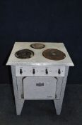 A 1950's FRENCH ELECTRIC STOVE with marbled enamel finish to body, three rings to top and oven (