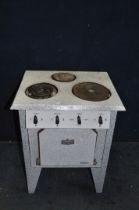 A 1950's FRENCH ELECTRIC STOVE with marbled enamel finish to body, three rings to top and oven (