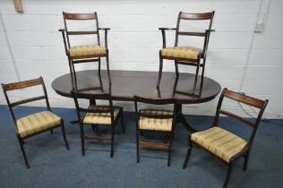 A 20TH CENTURY MAHOGANY TWIN PEDESTAL OVAL DINING TABLE, with one additional leaf, extended length