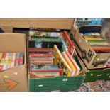 FIVE BOXES OF BOOKS containing over 100 miscellaneous titles in hardback and paperback formats,