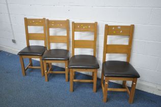 A SET OF FOUR OAK FRAMED DINING CHAIRS, with brown leatherette seat pads (condition report: