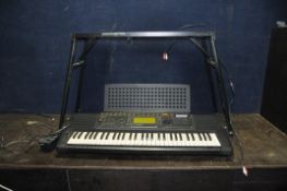 A YAMAHA PSR520 ELECTRONIC KEYBOARD with power supply and folding stand (PAT pass and working)