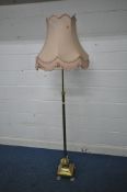 A BRASS STANDARD LAMP, with a Corinthian style pillar on a box and stepped base, with four paw feet,