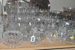 A LARGE QUANTITY OF GLASSWARE, comprising wine glasses, champagne flutes, sherry glasses,