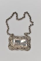 A GEORGE IV SILVER DECANTER LABEL, rectangular label with floral pattern, engraved 'Hollands',