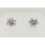 A PAIR OF 9CT GOLD STUD EARRINGS, round cut cubic zirconia, prong set in white gold, fitted with