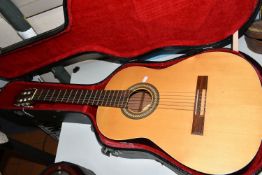 AN ALPHA 200 MODEL SIX STRING ACOUSTIC GUITAR, natural finish to the top surface, together with a