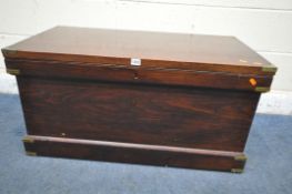 A STAINED PINE CAMPAIGN BLANKET BOX, with a hinged lid, twin brass handles and banding, width 95cm x