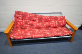 A MODERN BEECH AND TUBULAR METAL DAY BED, with red oriental upholstery, length 216cm x depth 100cm x