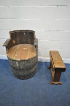 A BESPOKE ARMCHAIR ADAPTED FROM AN OAK COOPERED BARREL, with metal banding, approximate diameter