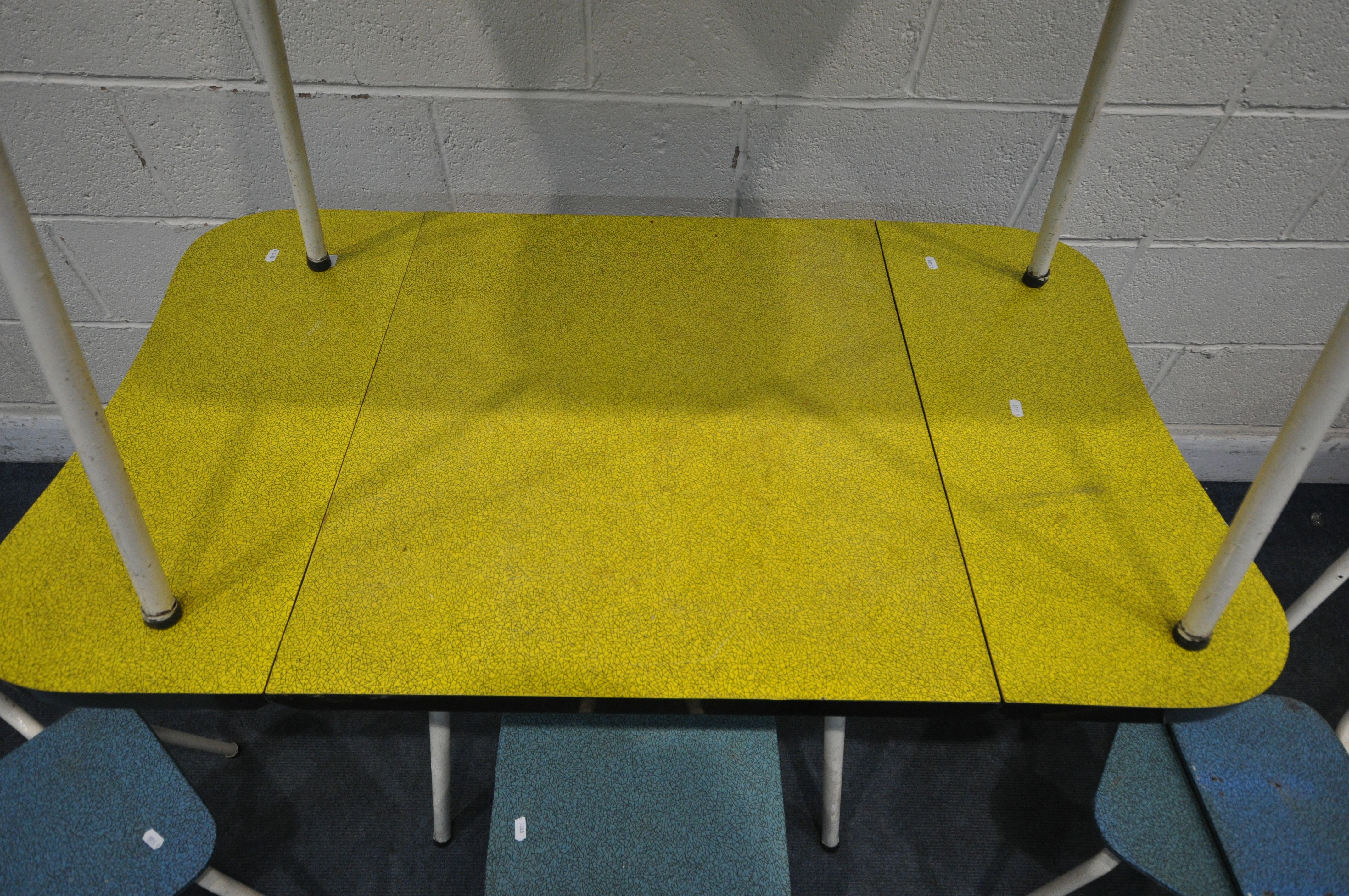 A MID CENTURY FORMICA TOP DROP LEAF TABLE, with concave ends, on tubular legs, length 118cm x closed - Image 3 of 4