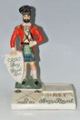 BREWERIANA: A GILBEY'S SPEY ROYAL WHISKY CERAMIC ADVERTISING STAND, a Staffordshire style Highland