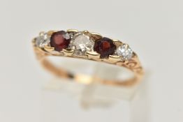 A 14CT GOLD DIAMOND AND GARNET FIVE STONE BOAT RING, set with three old cut diamonds, estimated