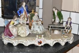 A SITZENDORF PORCELAIN FIGURE GROUP, depicting the six year old Mozart playing piano for a group