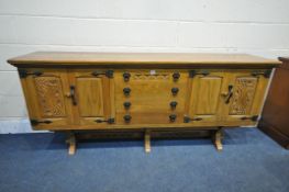 A WEBBER FURNITURE CROYDON RANGE OAK SIDEBOARD, fitted with four drawers, flanked by double doors,