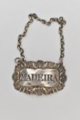 A GEORGE IV SILVER DECANTER LABEL, rectangular label with floral pattern, for 'Madeira',