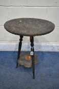 A 19TH CENTURY ORIENTAL PADAUK TWO TIER OCCASIONAL TABLE, the top circular surface carving depicting