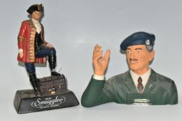 TWO WHISKY ADVERTISING FIGURES, comprising a rubberoid 'Old Smuggler' advertising figure depicting a