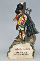 BREWERIANA: A WHITE LABEL DEWAR'S SCOTCH WHISKY ADVERTISING FIGURE, comprising a rubberoid Scots