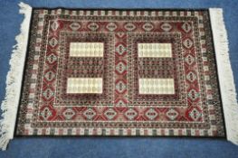 A SMALL RECTANGULAR ISPHAHAN SILK RUG, with a variety of repeating geometric patterns, 105cm x