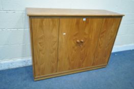A MID CENTURY WALNUT RECORD CABINET, the double bi-fold doors enclosing fourteen divisions, left