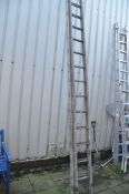 A SET OF LONG ALUMINIUM DOUBLE EXTENSION LADDERS with 17 rungs to each 460cm length