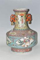 A CHINESE TURQUOISE FAMILLE ROSE PORCELAIN VASE, decorated around the centre by four panels