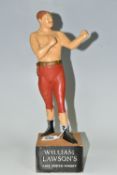 A WILLIAM LAWSON'S SCOTCH WHISKY ADVERTISING FIGURE, the rubberoid figure in the form of a bare